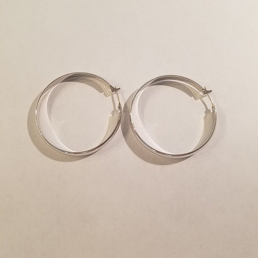 Silver tone hoop earrings